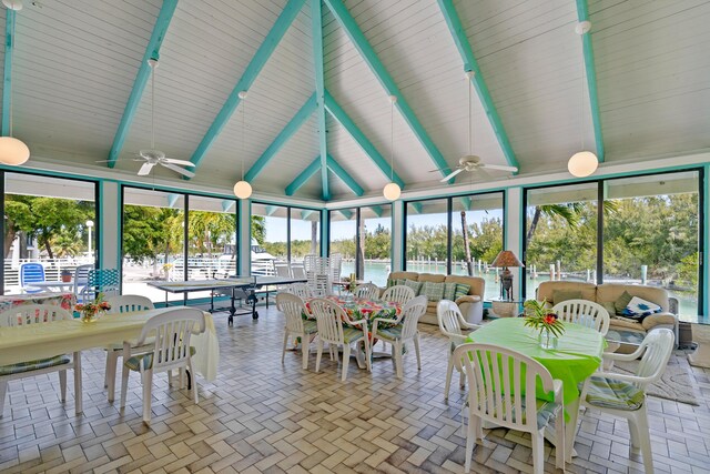 sunroom featuring beamed ceiling