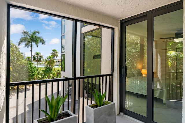 exterior space with a ceiling fan