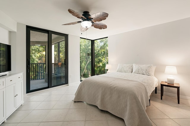 bedroom with light tile patterned flooring, a wall of windows, baseboards, a ceiling fan, and access to exterior