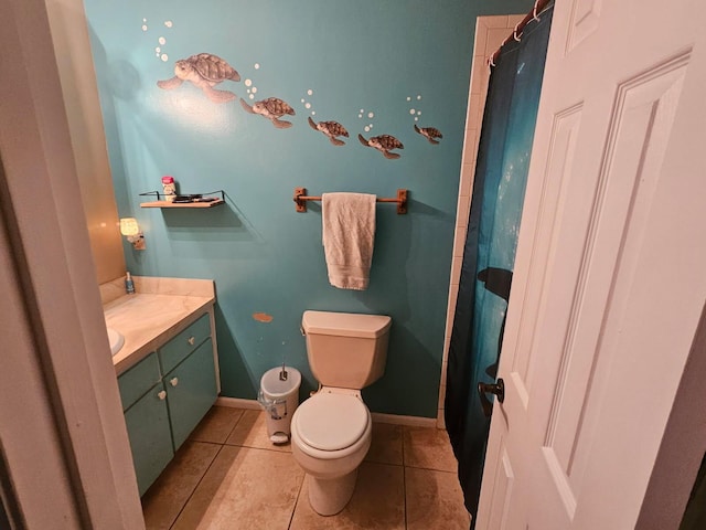 full bath with curtained shower, toilet, vanity, baseboards, and tile patterned floors