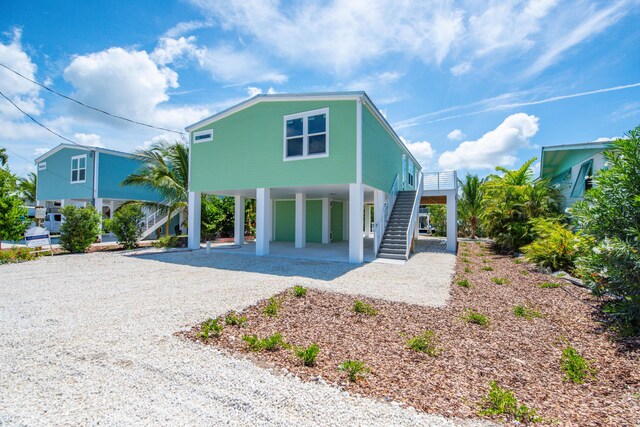 622 Diane Ave, Little Torch, FL 33042 - raised beach house featuring a carport, stairs, and driveway