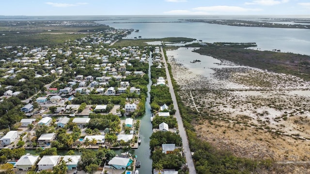 drone / aerial view with a residential view and a water view