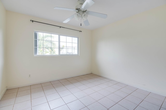 empty room with baseboards and ceiling fan