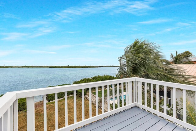 wooden deck featuring a water view