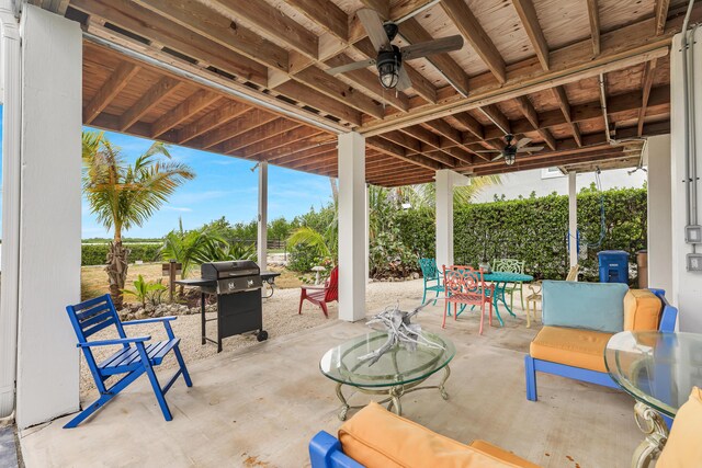 view of patio / terrace with a ceiling fan, outdoor dining area, and a grill