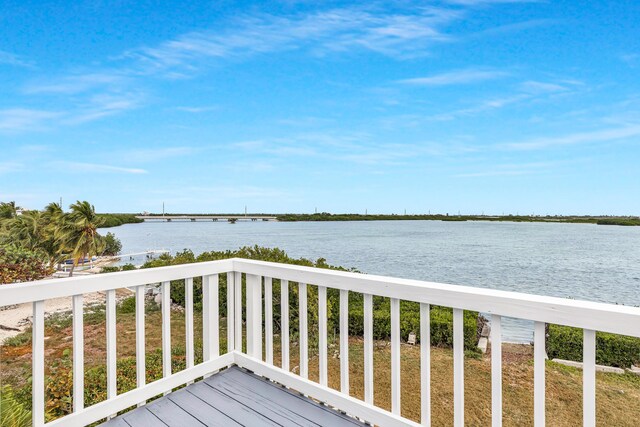 wooden deck featuring a water view