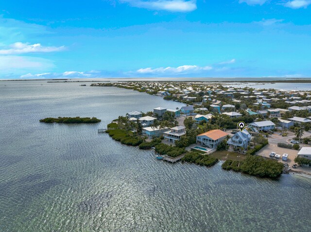 birds eye view of property featuring a water view and a residential view