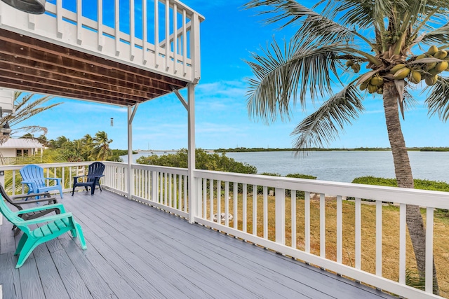 wooden deck featuring a water view