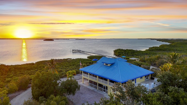 aerial view at dusk with a water view