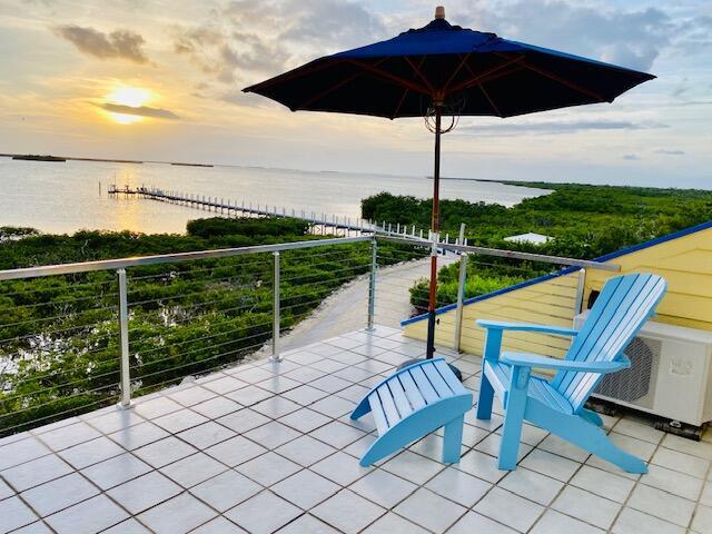 balcony featuring a water view