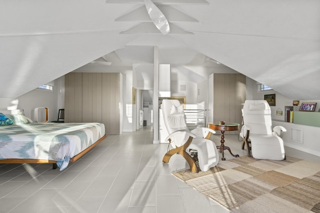 bedroom featuring vaulted ceiling, ceiling fan, and visible vents