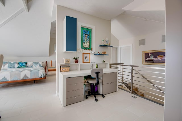 office space with vaulted ceiling and visible vents