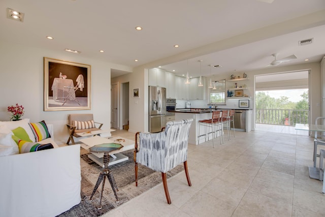 living room featuring ceiling fan, light tile patterned flooring, visible vents, and recessed lighting