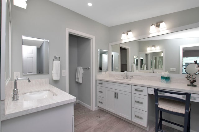 full bath with vanity, recessed lighting, and wood finished floors