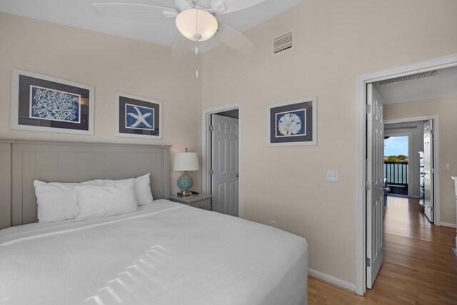 6005 Marina Villa Dr Unit C-019, Duck, FL 33050 - bedroom with wood finished floors, baseboards, and a ceiling fan