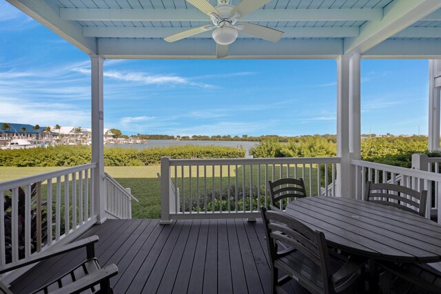 6005 Marina Villa Dr Unit C-019, Duck, FL 33050 - wooden deck with a ceiling fan, outdoor dining area, and a yard