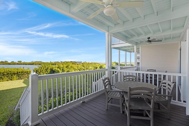 6005 Marina Villa Dr Unit C-019, Duck, FL 33050 - deck with ceiling fan, outdoor dining area, a water view, and a lawn