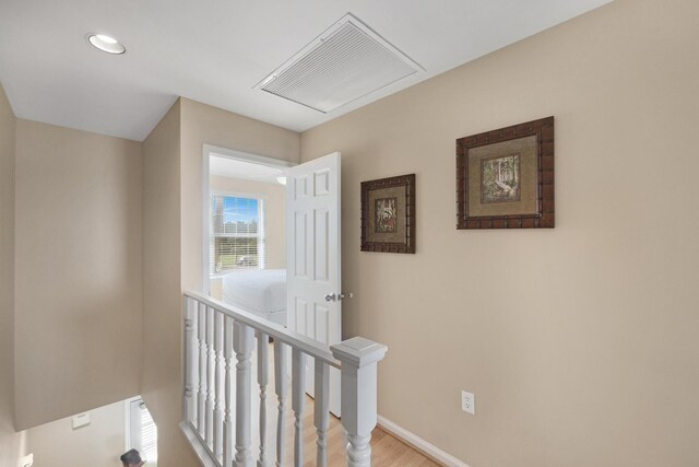 6005 Marina Villa Dr Unit C-019, Duck, FL 33050 - hall featuring an upstairs landing, light wood-type flooring, baseboards, and recessed lighting