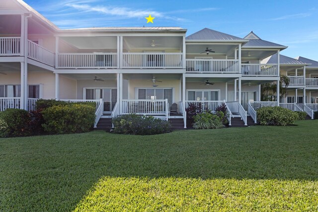 6005 Marina Villa Dr Unit C-019, Duck, FL 33050 - back of property featuring a ceiling fan, a lawn, and metal roof