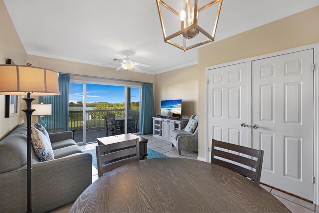 6005 Marina Villa Dr Unit C-019, Duck, FL 33050 - tiled living area with ornamental molding, a ceiling fan, and a chandelier