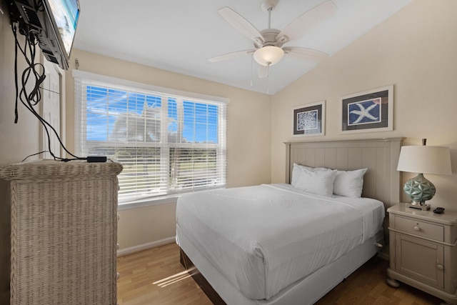 6005 Marina Villa Dr Unit C-019, Duck, FL 33050 - bedroom featuring wood finished floors, baseboards, vaulted ceiling, and ceiling fan
