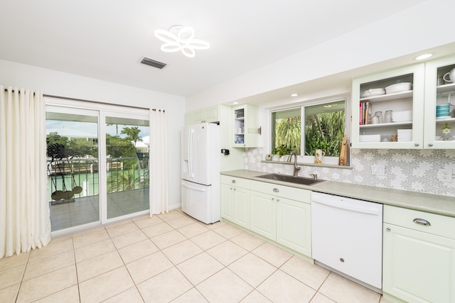 661 12th St, Key Colony, FL 33051 - kitchen featuring white appliances, a sink, glass insert cabinets, and light countertops