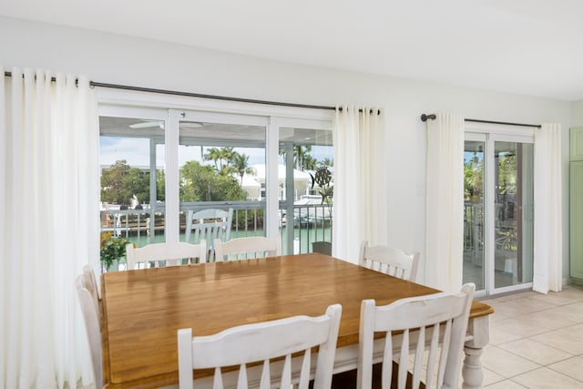 661 12th St, Key Colony, FL 33051 - dining area with light tile patterned flooring and a water view