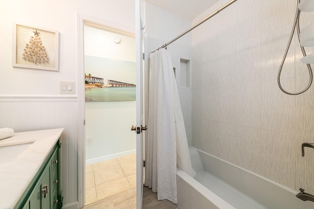 661 12th St, Key Colony, FL 33051 - bathroom with shower / tub combo, vanity, and a wainscoted wall