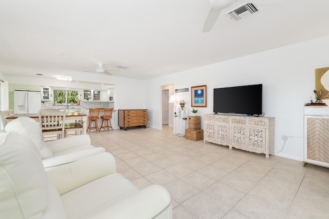 661 12th St, Key Colony, FL 33051 - living area featuring a ceiling fan, light tile patterned floors, and baseboards