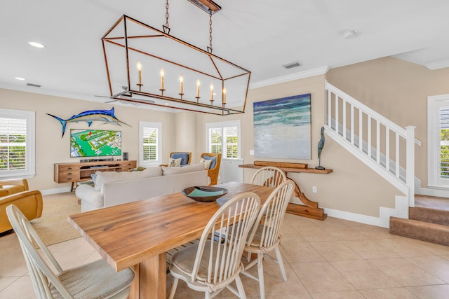 dining space with light tile patterned floors, visible vents, stairs, and ornamental molding