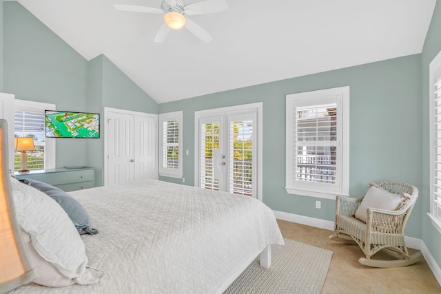 tiled bedroom with access to exterior, french doors, baseboards, and lofted ceiling