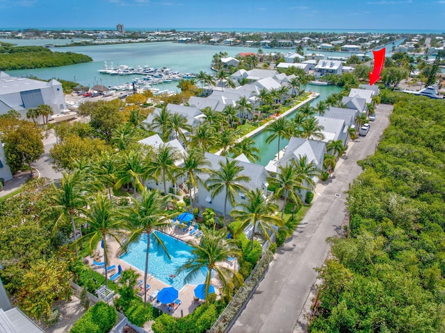 birds eye view of property featuring a residential view and a water view