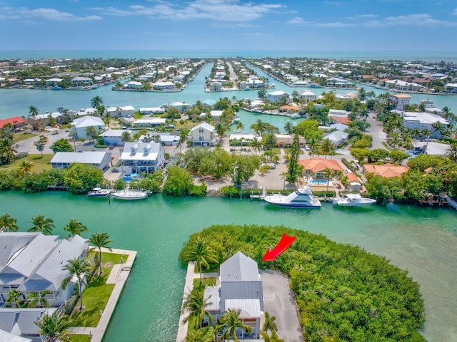 bird's eye view with a water view and a residential view