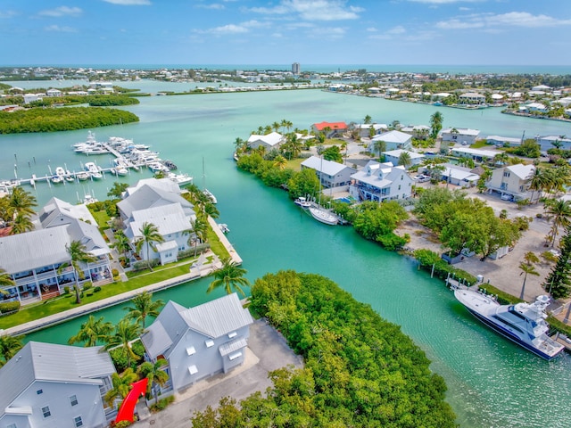 drone / aerial view with a residential view and a water view