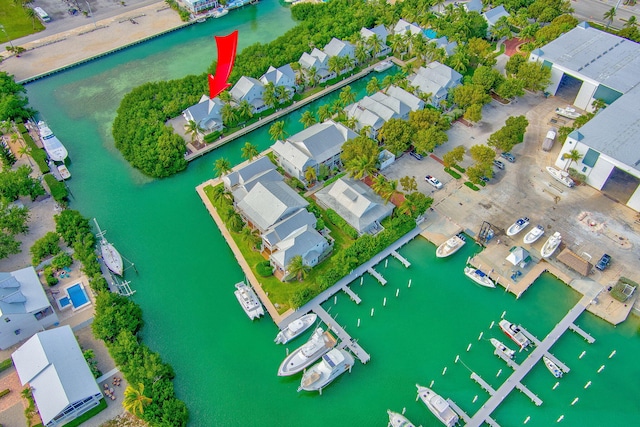 birds eye view of property featuring a water view and a residential view