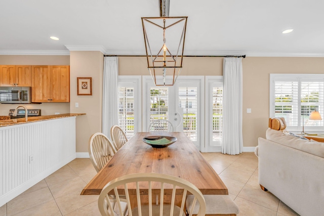 dining room with light tile patterned flooring, recessed lighting, and crown molding