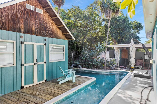 outdoor pool with a deck