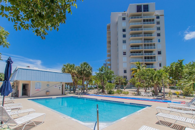 community pool with a patio area