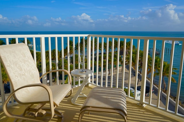 balcony featuring a water view