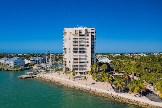 drone / aerial view featuring a beach view and a water view