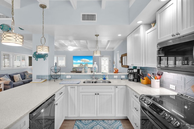 8 Sadowski Cswy, Key Colony, FL 33051 - kitchen featuring stainless steel microwave, a sink, dishwasher, stove, and backsplash