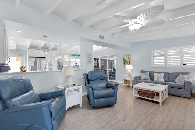8 Sadowski Cswy, Key Colony, FL 33051 - living room with baseboards, plenty of natural light, light wood finished floors, a ceiling fan, and beam ceiling