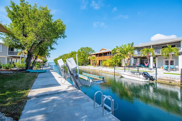 dock area featuring a water view and boat lift