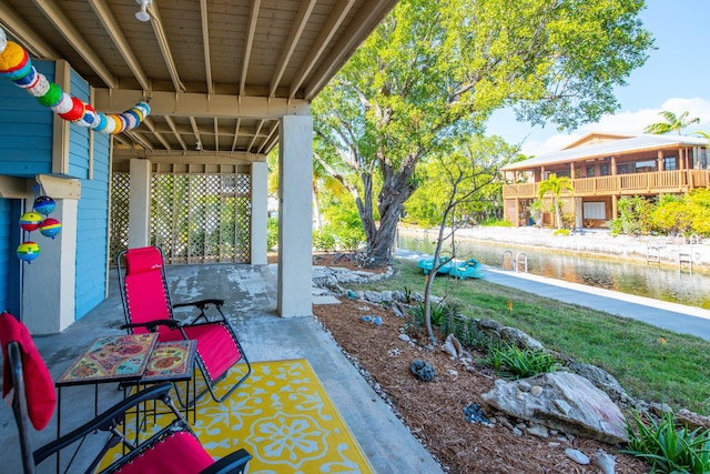 view of patio featuring a water view