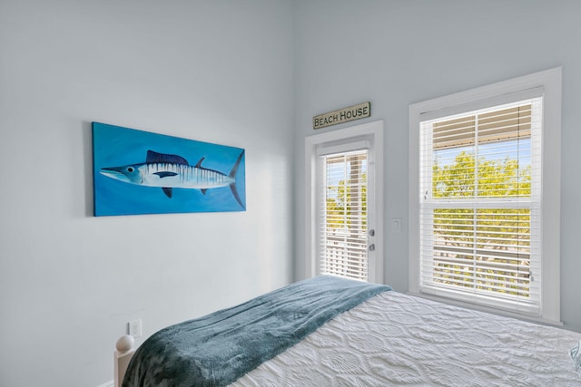 12399 Overseas Hwy Unit 12, Marathon, FL 33050 - bedroom featuring access to exterior and baseboards