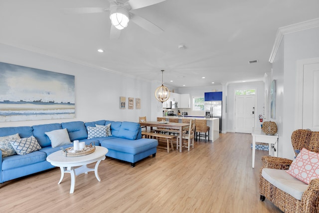 12399 Overseas Hwy Unit 12, Marathon, FL 33050 - living area featuring crown molding, ceiling fan with notable chandelier, light wood finished floors, visible vents, and recessed lighting