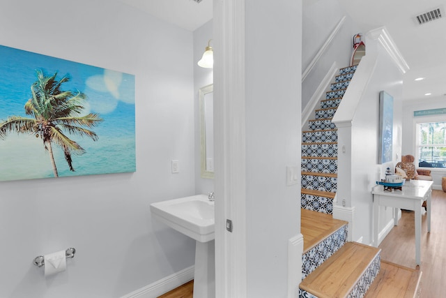 12399 Overseas Hwy Unit 12, Marathon, FL 33050 - bathroom featuring baseboards, wood finished floors, and visible vents