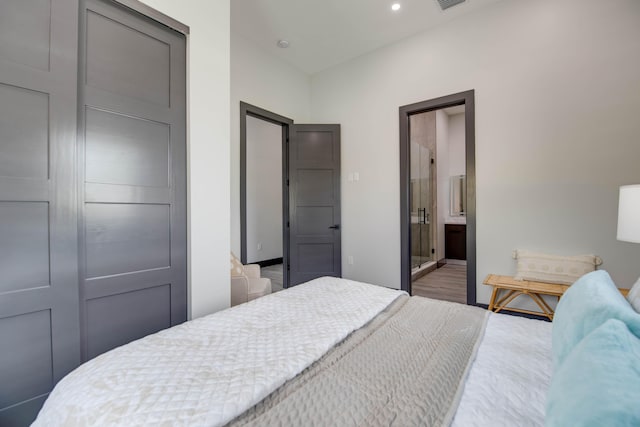 3702 Duck Ave, Key West, FL 33040 - bedroom with visible vents, ensuite bathroom, baseboards, recessed lighting, and wood finished floors