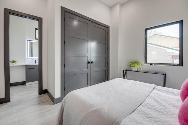 3702 Duck Ave, Key West, FL 33040 - bedroom featuring light wood-type flooring, a closet, and baseboards