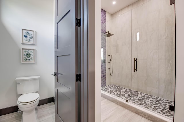 3702 Duck Ave, Key West, FL 33040 - full bath featuring recessed lighting, wood finished floors, a shower stall, toilet, and baseboards